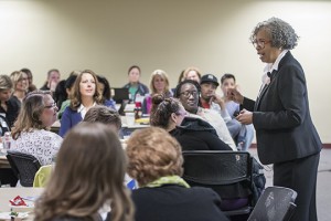 Gloria Ladson-Billings in front of a workshop classroom.
