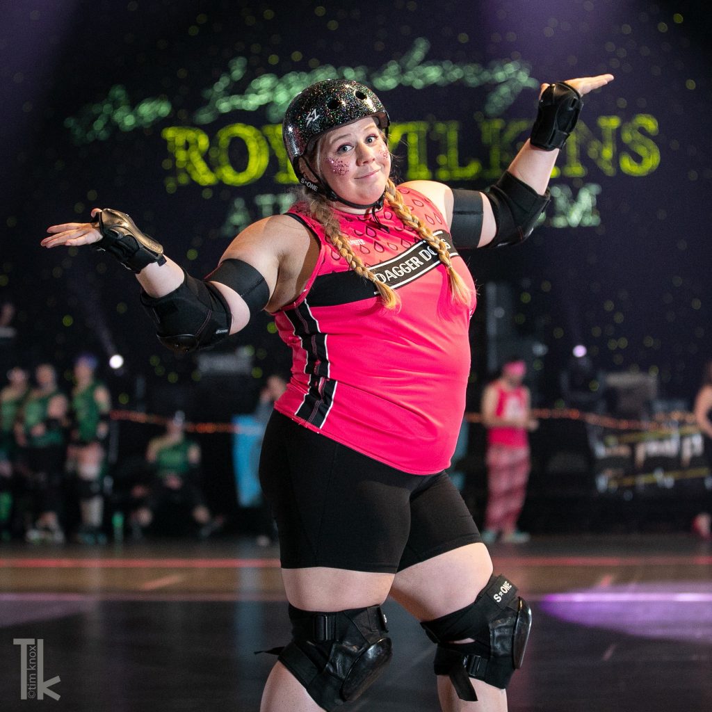 Cara posing during a roller derby bout